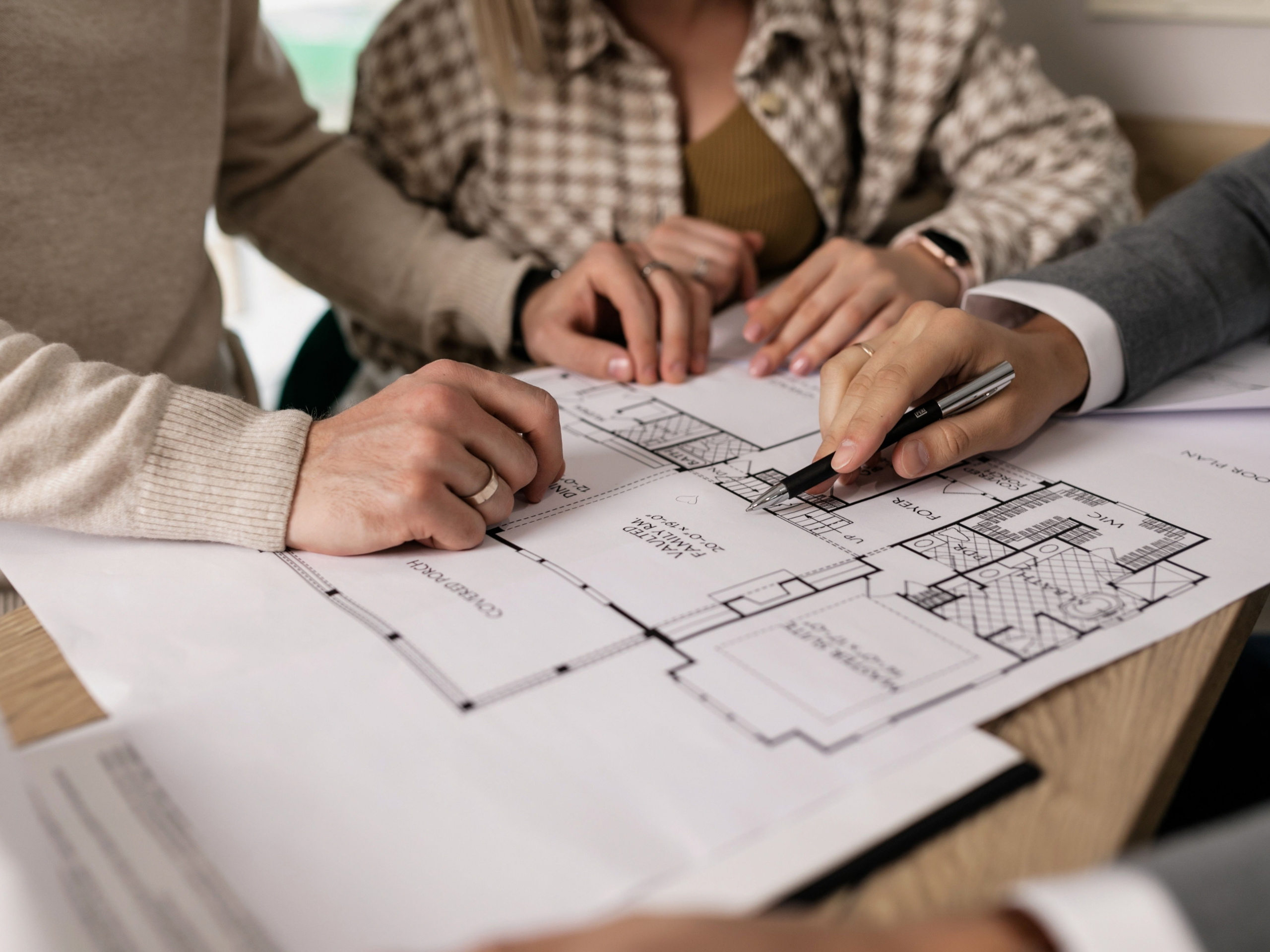 Interior designer reviewing project plans, representing digital marketing services for architects and interior designers